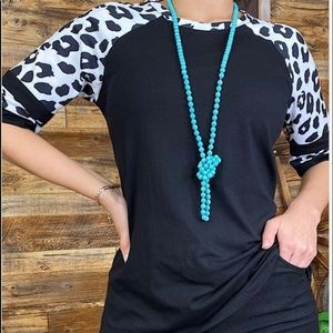 Black womens top with animal print bell sleeve